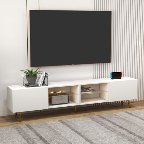 PRICES MAY VARY. 85" LED TV Stand: Size-86.6" * 13.9" * 19.5", this 85+ inch TV stand fits most TV screens from 55" to 100", it can meet your different needs Changing Colors LED Lights: Life needs a sense of ritual, colorful lights make your life relaxing and exciting. The LED TV Stand includes 15 Colors and 4 Lighting Patterns. You can change lights with a remote with ease Storage Space: Multi-zone storage, orderly, organized commonly used books and publications to avoid clutter. The surface of