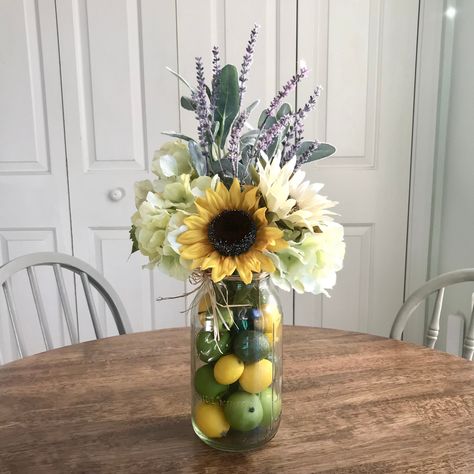 Farmhouse Table Centerpieces Living Room, Kitchen Table Floral Centerpiece, Rustic Farmhouse Kitchen Ideas Country Home Decor, Kitchen Table Flower Arrangements, Simple Sunflower Arrangements Vases, Sunflower Fall Floral Arrangements, Lemon Centerpiece Ideas Kitchen, Lemon And Sunflower Decor, Artificial Wildflower Arrangements