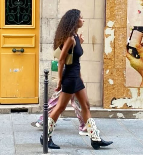 @parisiensinparis shared a photo on Instagram: “Bombshell 💣 Black mini dress. Cowboy boots. Spotted in 75001. Spotted by @alejandrahernandezr_…” • Jul 22, 2021 at 6:01am UTC Black Dress And Cowboy Boots, Dress With Black Boots, White Cowboy Boots Outfit, Dress And Cowboy Boots Outfit, Dress Cowboy Boots, Dress And Cowboy Boots, Western Boots Outfit, Cowgirl Boots Outfit, Dresses With Cowboy Boots