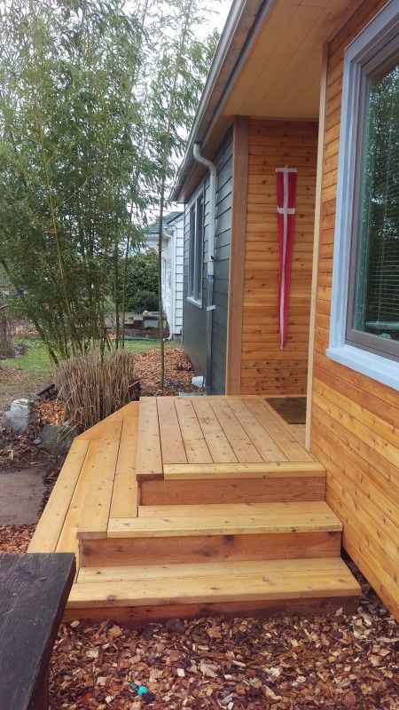 Wrap around front steps | Deck Masters, LLC Deck Wrap Around Stairs, Step Down Porch Ideas, Backdoor Steps Ideas, Outdoor Stairs To House Entrance Wood, Entry Deck And Steps, Deck Stairs No Railing, Front Deck Steps Ideas, Wrap Around Porch Steps, Cascading Front Porch Steps