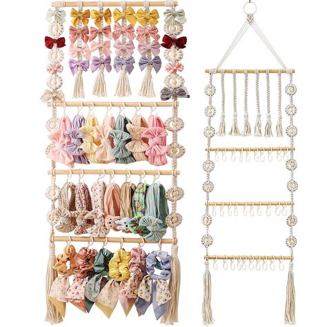 PRICES MAY VARY. Bow and Headband Organizer: This meticulously hand woven hanging organizer from GRDYEAAR provides a versatile solution for storing your little one's hair bows, headbands, hair clips and ribbons, making it an excellent choice as a bow holder, baby bow organizer and headband holder. 51 inches high * 14 inches wide Saves space: As a one-stop storage solution, this bow holder for girls' hair bows helps declutter your space by providing an organized place to store hair accessories. E Cloth And Plastic Organizer For Hair Extensions, Bow Basket Holder, Frame Hair Bow Holder, Hair Claw Clips Organizer, Baby Headband Rack, Bow Storage Frame, Hair Bow And Scrunchie Holder, Hidden Bow Storage, Mermaid Bow Hanger