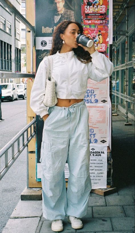 Eva Gutowski on Instagram - nyc street style - parachute pants Shoes With Parachute Pants, Street Style Parachute Pants, Cargo Parachute Pants Outfit Winter, How To Style Parachute Cargo Pants, Eva Gutowski Outfits, Light Blue Parachute Pants Outfit, Parachute Pants Street Style, How To Style Parachute Pants, Parachute Pants Outfit Winter