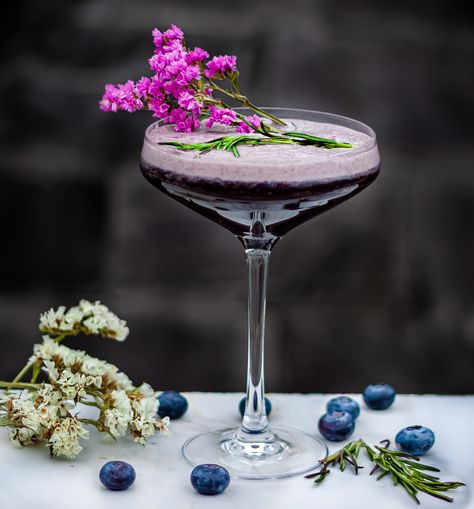 Let’s celebrate summer’s bounty by pairing Blueberry and Rosemary that complement each other perfectly. Combining the flavours of an aromatic herb with the delicate sweet flavours of a berry is not uncommon. Therefore, we decided to pair Blueberries and Rosemary for our next cocktail. Blueberries are extremely versatile berries that work with almost all herbs. Pairing it with savoury rosemary is like a match made in heaven. Amaro Cocktails, Blueberry Gin, Vermouth Cocktail, Lobster Risotto, Gin Sour, Parmesan Cream Sauce, Glazed Pork Chops, Sloe Gin, Lemon Rosemary