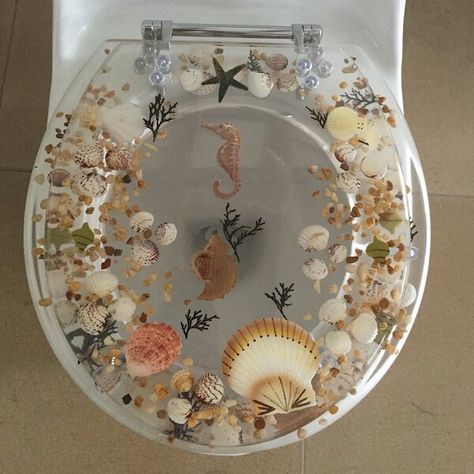 Add a touch of the beautiful ocean in your lavatory with this fish toilet seat. This elongated toilet seat is constructed from high-quality acrylic to ensure that it is sturdy and will last for a long time. Ergonomic and highly comfortable, this seat has a novelty finish that makes the underwater scenery look appealing. This corrosion-proof fish acrylic toilet seat can be cleaned regularly with warm soapy water. This toilet seat has chrome hinges that blend perfectly with the finish of the seat. Sea Treasure, Round Toilet, Elongated Toilet Seat, Elongated Toilet, Toilet Seats, Natural Therapy, Seahorses, Dream House Decor, Toilet Seat