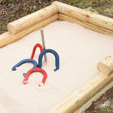 picture of horseshoe game Diy Horseshoe Pit, Horseshoe Pit Dimensions, Horseshoe Game, Diy Yard Games, Outside Fire Pits, Landscape Timbers, Horseshoe Projects, Flower Bed Designs, Horseshoe Crafts