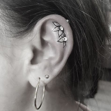 Ear Tattoo With Piercing Flowers, Ear Tattoo Inner With Piercing, Ear Flower Tattoo With Piercing, Small Tattoo By Ear, Ear Piercing And Tattoo, Flower Ear Tattoo With Piercing, Flower In Ear Tattoo, Inner Ear Tattoo With Piercing, Sunflower Ear Tattoo