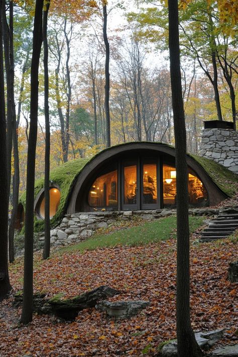 Modern forest house hobbit style earth sheltered facade. Check out all of these creative forest houses that blend rustic charm with modern elegance, making the woodland retreat truly unique. Unique House Plans Modern, Hidden House In The Woods, Modern Hobbit House, Modern House Nature, Earth Homes Design, Earth Homes Underground, Hobbit Inspired House, Hobbit Architecture, Hobbit Cabin