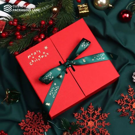 From shimmering ribbons to festive motifs, our packages are designed to make every present a celebration. Share the spirit of the season with beautifully wrapped surprises that sparkle with the warmth of Christmas! #customboxes #christmasboxes #christmasideas #custompackaging #designinspo #packagingideas #packagingsolution #designinspiration #custompackaginglane #packagingindustry2023 Hardbox Packaging, Christmas Gift Photography, Christmas Packaging Design, Hampers Natal, Christmas Food Photography, Xmas Hampers, Merry Christmas Poster, Christmas Boxes, Christmas Shoot