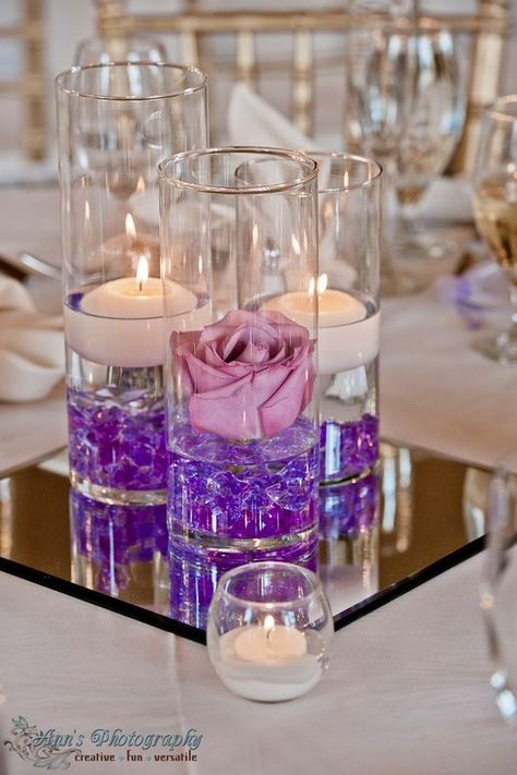 Purple Floating Candle Wedding Centerpiece / http://www.himisspuff.com/purple-wedding-ideas/13/ Quinceanera Decorations, Cylinder Vase, Vase Centerpieces, Floating Candles, Wedding Table Centerpieces, Cheap Wedding, Purple Wedding, Decoration Table, Quinceanera