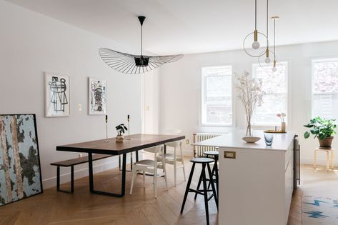 A view of the open kitchen/dining area with a Constance Guisset Vertigo Pendant Lamp. Mid Century Bedroom Decor, Vertigo Pendant, Townhouse Renovation, Lavatory Design, Pink Living Room Decor, Gray And White Bathroom, Scandinavian Dining Room, Mid Century Bedroom, Blue Bathroom Decor