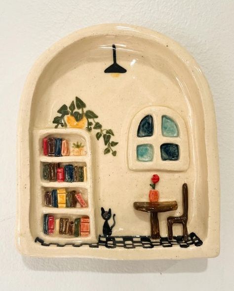 Love in Pottery on Instagram: "beautiful ceramic Library Wall Hanging 📚🪴🐈‍⬛ by @hazelbean_ceramics ! 🙈😘💚 FOLLOW👉 @loveinpottery for more pottery contents ☕️ !  Credit 📷💚 @hazelbean_ceramics  visit their page and support 💕  Follow us on @musthomeguide (Interior Lovers) @mustvisitguide (Travel Lovers) & @dailyartlist (Art Lovers) !  #sculpture #artist #ceramicsculpture #ceramic #design #potterylove #ceramica #craft #ceramicart #stoneware #handmadeceramics #handmade #instapottery #pottersofinstagram #wheelthrown #tableware #contemporaryceramics #homedecor #art #keramik #clay #porcelain #interiordesign #ceramicstudio #glaze #ceramicartist" Clay Wall Hanging, Ceramics Pottery Bowls, Pottery Houses, Library Wall, Air Dry Clay Projects, Cerámica Ideas, Clay Diy Projects, Mini Wall, Coffee Dripper