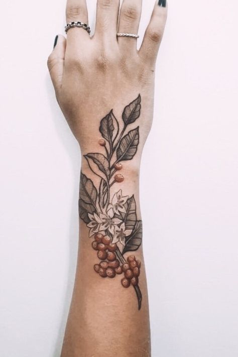 #coffeetatoos #tattooideas Coffee Plant Tattoo Color, Cuban Coffee Tattoo, Coffee Cherry Tattoo, Coffee Berry Tattoo, Coffee Leaves Tattoo, Hand Plant Tattoo, Wrist Plant Tattoo, Flower And Plant Tattoos, Coffee Bean Plant Tattoo