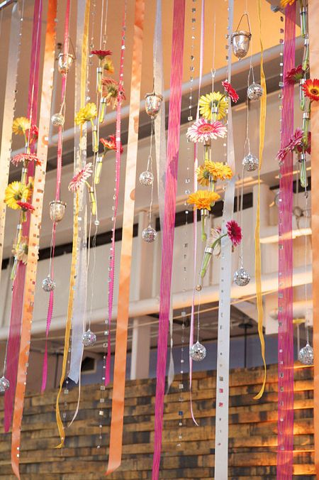 Wedding curtain made up of ribbons, flowers and ornaments. #Reception #Decor #Ribbons #Celebstylewed. @Celebstylewed Ribbon Wedding Decorations, Ribbon Curtain, Ribbon Backdrop, Fiesta Wedding, Curtain Backdrops, Flower Curtain, Ribbon Decorations, Ribbon Wedding, Baltimore Wedding