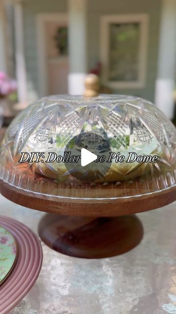 Leslie Rodgers on Instagram: "Sharing a beautiful Dollar Tree Store DIY Domed Pie Cover. This DIY came together so quickly and looks so fancy when used to entertain ourdoors! I used rub n buff antique gold to stain a wooden dowel cap and then used hot glue to attach a flat crystal bezel to the dowel and then glued the knob I created to the bottom of an acrylic dollar tree bowl to create a beautiful, inexpensive care free cake or pie cover thats perfect for dining al fresco, and cost me under 2 dollars to make.  #tablescape #picnic #easydiy #easycrafts #springtable"