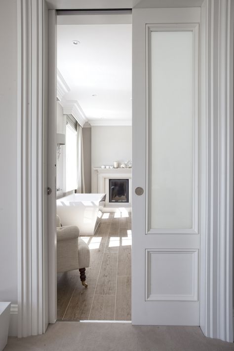 A cool natural lighting tip is to remove doors entirely for better light flow, especially in a tiny apartment. Rasheeda Frost, Double Doors Interior, Sliding Pocket Doors, Design Blogs, Closet Door, White Living, White Living Room, Tile Flooring, Bathroom Doors