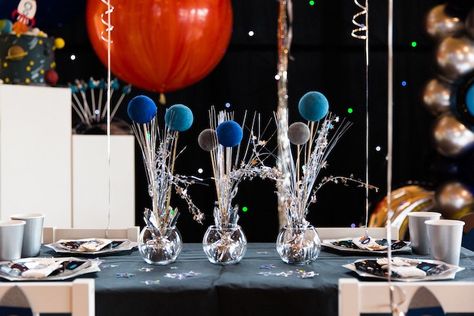 Space Theme Birthday Centerpiece, Outer Space Centerpiece Ideas Diy, Space Themed Birthday Party Centerpiece, Nasa Party Ideas Space Theme, First Trip Around The Sun Table Centerpieces, Space Party Centerpiece Table Decorations, Space Theme Cake Table, Space Birthday Table Decorations, Space Centerpiece Ideas Birthday