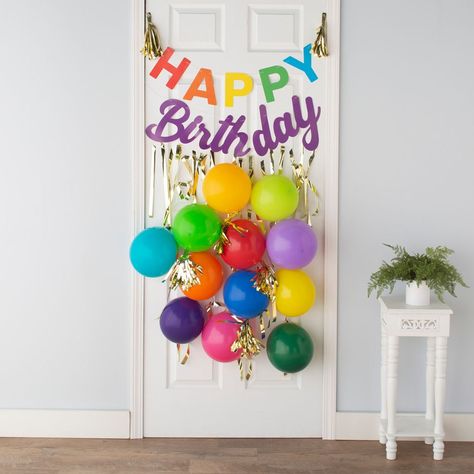 Surprise your birthday boy or girl with this sign on their front door or as part of their birthday decorations! Featuring a brightly colored "Happy birthday" hanging sign along with balloons and other hanging décor, this kit can help you throw a birthday bash for the memory books. (31 pcs. per unit) Includes one 1" x 36" clear plastic hanger, twelve 1/2" x 6 ft. 6" foil stripes, two foil cardstock garlands, four 6" gold foil tassels, three 11" gold latex balloons and nine 11" multi-colored latex balloons. Teacher Birthday Door Decorations Ideas, Door Decor Birthday, Door Decoration For Birthday, Front Door Birthday Decorations, Bday Door Decoration, Birthday Front Door Decorations, Office Decor Birthday, Front Door Birthday Decor Entrance, Birthday Porch Decorations