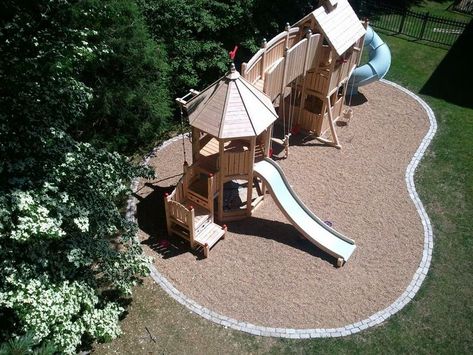 borders for pea gravel | Wooden playset with pea gravel and border Playground Architecture, Playset Landscaping, Playground Landscaping, Backyard Kids, Backyard Playset, Backyard Structures, Gravel Landscaping, Play Area Backyard, Backyard Kids Play Area