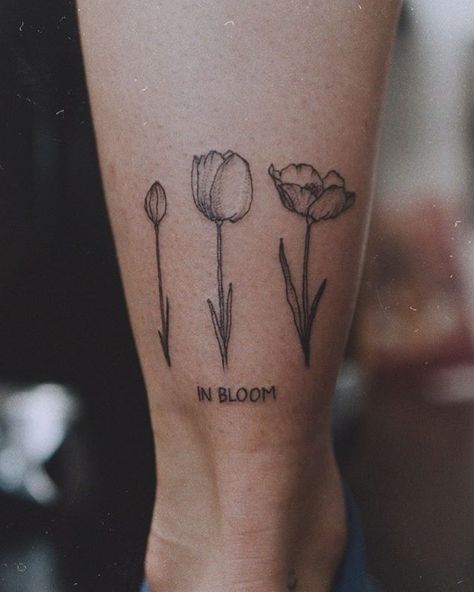 in bloom💕✨ thank you so much! Gardening Tattoos For Women, Plant Lover Tattoo Ideas, Bloom Tattoo Words, In Bloom Tattoo, Heartbreaker Tattoo, Blooming Tattoo, Gardening Tattoo, Bloom Tattoo, Cursive Tattoos