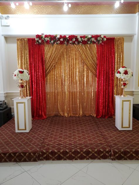 We did this backdrop as per clients taste gold and red with columns for  florals also our flower row on top .Simple but beautiful Quince Backdrop Ideas Red And Gold, Background For Party Backdrop Ideas, Red And Gold Quinceanera Backdrop, Red And Gold Quince Backdrop, Red And Gold Photo Backdrop, Red Backdrop Ideas, Quince Decorations Red And Gold, Red And Gold Backdrop, Quince Decorations Red