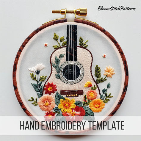 This charming design features a beautifully adorned guitar surrounded by intricate floral patterns, offering a harmonious blend of nature and melody. Let your stitching skills strum a sweet tune with this delightful pattern! Explore our store for more musical inspirations! #FloralGuitar #HandEmbroidery #EmbroideryPattern #DIYCrafts #EmbroideryInspiration #Stitching #Crafting #PinterestCrafts #EmbroideryDesigns Guitar With Flowers, August Song, Guitar Embroidery, Music Embroidery, Embroidered Guitar, Floral Guitar, Beginner Embroidery, Pinterest Crafts, Embroidery Diy