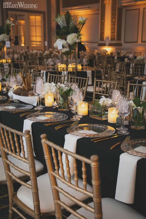 Black Wedding With Gold Accents, Black And Gold Wedding Place Settings, Black And Gold Place Setting Wedding, Gold And Black Wedding Table Setting, Black Gold And Glass Wedding, Gold White Wedding Table Setting, Black Wedding Table Linens, Gold Chivari Chairs Black Table Cloth, Black Gold And Ivory Wedding Table Settings