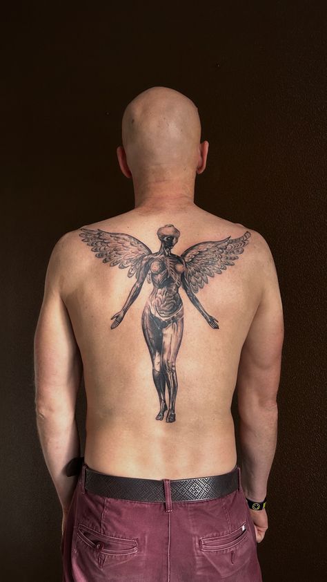 #tattoo #nirvana #nirvanatattoo #backtattooart #musictattooideas #ink #inked Nirvana Back Tattoo, Dystopia Tattoo, Nirvana Angel Tattoo, In Utero Tattoo, Angel Back Tattoo, Outlaw Tattoo, Nirvana Tattoo, Tattoo 2024, Piece Tattoo