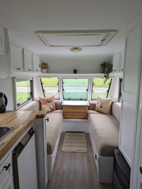 Renovation of touring caravan, white paint, Shein covers, oak worktop, black handles Caravan Cushion Covers, Paint Caravan Exterior, Painting Caravan Interior, 2 Berth Caravan Interior, Caravan Door Ideas, 2 Berth Caravan Makeover, White Caravan Interior, Touring Caravan Makeover, Caravan Upcycle