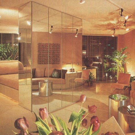 #TBT  The epitome of style in 1982, this floor-to-ceiling mirror setup was believed to give the feeling of more space, and also hid cabinetry and an entertainment center.  You might notice the angled lighting created a dramatic effect and helps point your eyes where the interior designer wanted you to focus.  #UnitedRealEstateChicago #RealEstate #RealEstateForSale #RealEstateExpert #CreditRepair #CreditRepairman #Homes #Chicago #GlenEllyn #GlendaleHeights #Wheaton #CarolStream #Bloomingdale 80s Living Room, 1980s Interior Design, 1980s Interior, 90s Interior, 70s Interior Design, 80s Interior Design, 80s House, 80s Bedroom, 90s Home