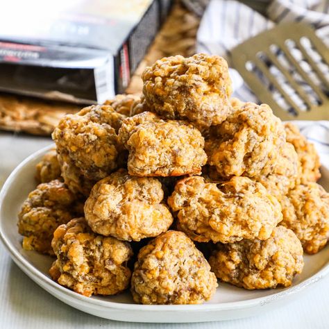 Discover the joy of simplicity and flavor with these easy Red Lobster Cheddar Bay Biscuit Sausage Balls—your go-to for the best sausage ball recipe that's perfect for breakfast, brunch, or a holiday appetizer. Featuring a delightful blend of breakfast sausage and sharp cheddar, these easy sausage balls are a crowd-pleasing sensation. Effortless to make ahead and freezer-friendly, elevate your snack game with these bites that promise to steal the show at any gathering. Cheddar Bay Biscuit Sausage Balls, Sausage Ballls, Biscuit Sausage Balls, Elevated Snacks, Cheddar Bay Sausage Balls, Best Sausage Ball Recipe, Sausage Ball, Sausage Balls Recipe, Red Lobster Biscuits