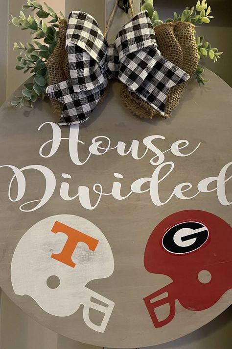 House divided, hearts united. In today’s post, I’m sharing 30 of the best ideas when it comes to house divided football decor. These ideas cover everything from wall hangings, outdoor decor, door hangings, welcome mats, and other super cool finds. The best part - they all feature more than one football team! Get ready for some fun and colorful ideas to spruce up your home and showcase your family’s love of the game. Tap or click to keep reading! House Divided Football, Football Door Hangers, Football Diy, Football Crafts, Football Decor, Cool Finds, Football Signs, Door Hangings, Football Wreath