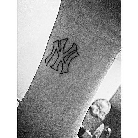 Wrist tattoo of the New York Yankees logo. Tattoo Artist: Jon Boy · Jonathan Valena Made In Ny Tattoo, New York Yankee Tattoo Ideas, Yankee Logo Tattoo, New York Yankee Tattoos, New York Yankees Tattoo Ideas, Yankee Tattoo For Women, Ny Yankees Tattoo, Yankees Tattoo Ideas, Yankees Logo Tattoo