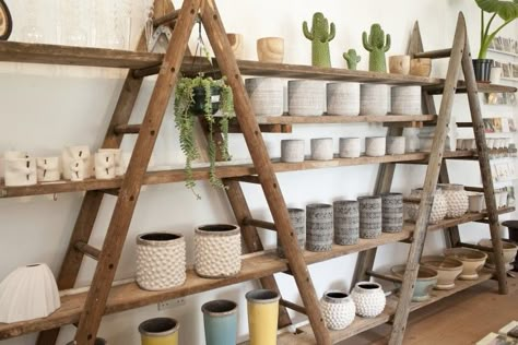 Ladder Market Display, Rustic Retail Display Ideas, Camping Store Interior, Rustic Shop Display, Diy Store Shelves, Diy Shop Shelving Ideas, Diy Retail Display Shelves, Rustic Store Design, Diy Store Display