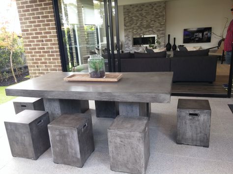 PHOTO 6: Concrete outdoor table with metal chairs that cover with cement. It is a clever idea to use for outdoor as it is tough enough to withstand the weather and still gives you the elegant look to the place. It works well with any industrial, rustic, or contemporary design of a home. Outdoor Concrete Table And Chairs, Table With Metal Chairs, Concrete Outdoor Dining Table, Fire Pit Coffee Table, Concrete Outdoor Table, Cement Table, Concrete Interiors, Wood And Concrete, Outdoor Living Design