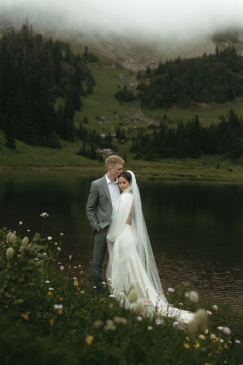 Hannah and Marcus decided to elope in the stunning mountains of Mount Rainier. Their intimate adventure elopement was sweet, surrounded by close family and friends. I feel fortunate to capture these romantic moments. If you need a wedding photographer for your destination elopement, reach out through my website today! Mountain Wedding Bride And Groom, Elopement Wedding Mountain, Bride And Groom Mountain Photos, Montana Wedding Elopement, Ireland Wedding Elopement, Elopement Aesthetic Mountains, Dreamy Elopement Photos, Nature Elopement Photos, Bridal Photos Mountains