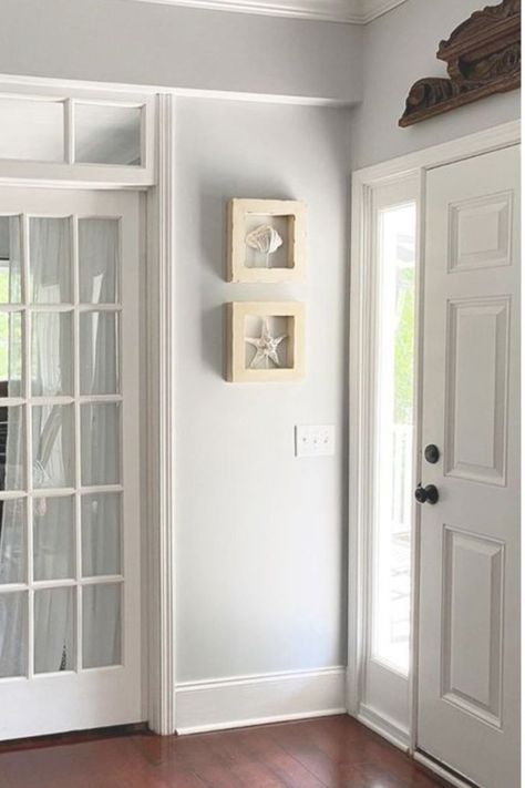 Entry walls are painted Behr Sterling (a light grey with blue undertones) and paired with white moldings - This Girl Paints. #behrsterling #lightgrey #paintcolors #greypaint Behr Tranquil Gray, Behr Sterling, Light Blue Grey Paint, Bedroom Paint Colors Grey, Grey Interior Paint, Warm Grey Paint Colors, Warm Gray Paint, Light Grey Paint Colors, Grey Walls Living Room