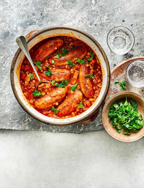 Pack protein into this hearty one-pot with pork sausages, smoked bacon and homemade baked beans Puy Lentil Recipes, Sausage And Bean Casserole, Sausage Casserole Recipes, Homemade Baked Beans, Boston Baked Beans, Beans And Sausage, Best Sausage, Sausage Casserole, Bacon Sausage