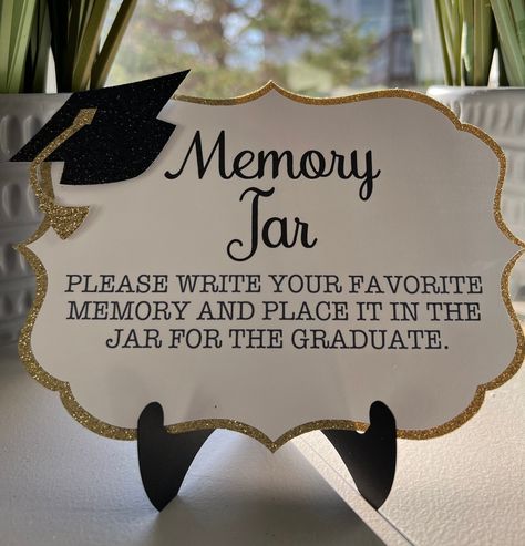 NOTE: THERE ARE 2 DIFFERENT DESIGNS AND SIZES IN MY SHOP. Add this Memory sign to your graduates party.  Pick your colors to match the party. Includes 25 note cards in white Cardstock  to match the signs design. 1 Piece Sign Measures 7x5 Paper easel not included but sold in my shop. https://www.etsy.com/listing/1197168659/paper-easel-sign-holder-graduation?click_key=0a7e4a26e7e1c7cb02022dfc81b1c6563cd4f044%3A1197168659&click_sum=15e37fb5&ref=shop_home_active_37&crt=1&sts=1 Graduation Party Words Of Wisdom Jar, Graduation Display Table, Memory Jar Graduation, Graduation Party Colors, Graduation Display, Graduation Party Desserts, Modern Graduation Party, College Grad Party, Graduation Memories