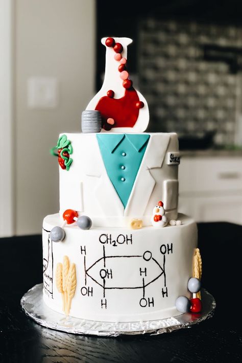 My sister recently graduated with her Food Science and Human Nutrition Master’s Degree. I wanted to have a custom food science cake designed for her, but there were limited food science cake ideas… Cake For Science Student, Chemical Engineering Graduation Party Ideas, Science Beaker Cake, Chemistry Cake Ideas, Biology Cake Ideas, Laboratory Cake, Physics Cake, Science Cake Ideas, Science Birthday Cake