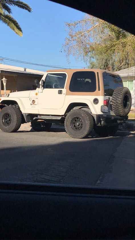 Brown and tan vintage Jeep on road Brown Jeep Aesthetic, Jeep Wrangler Old Model, Older Jeep Wrangler, 2000s Jeep Wrangler, Cream Jeep Wrangler, Jeep Wrangler Brown Interior, Vintage Jeep Aesthetic, Old Jeeps Vintage, Aesthetic Jeep Interior