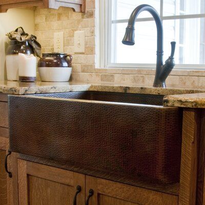 The open farmhouse sink is hand hammered from 100% recycled copper by our master artisans. Through years of skill and experience passed down from previous generations, the result is a one-of-a-kind work of art. Made from 16 gauge copper, this luxurious single large sink with a front apron has a warm antique finish and allows for either drop-in or under-mount installation. A 33" x 22" Single Farmhouse Kitchen Sink makes washing any dishes a breeze. It has a 3.5" drain for standard U.S. plumbing c Kitchen Sink Remodel, Tuscan Kitchen, Ideas Hogar, Farmhouse Sink Kitchen, Copper Kitchen, Kitchen Remodeling Projects, Luxury Kitchens, House Remodel, Kitchen Sink Faucets