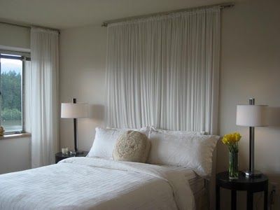 Sheer Curtains as headboard - this looks like our guest bed - have carolina blue sheers - would that work, or is it the monochromatic that makes it fit? Bedroom Ideas No Headboard, White Headboard Bedroom, Cheap Diy Headboard, Curtains Behind Bed, Headboard Alternative, Faux Headboard, Simple Headboard, Headboard Curtains, Pallet Headboard