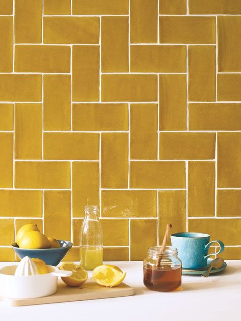 While these Carnival Oro Tiles from Fired Earth would look lovely as part of an otherwise white scheme, we also love the idea of choosing a complementary botanical wallpaper. #metrotiles #yellow #mustard #kitchen #kitchentiles #realhomes Tiles Ideas, Decorative Wall Tiles, Metro Tiles, Yellow Tile, Fired Earth, Kitchen Wall Tiles, Yellow Kitchen, Kitchen Tile, Trendy Kitchen