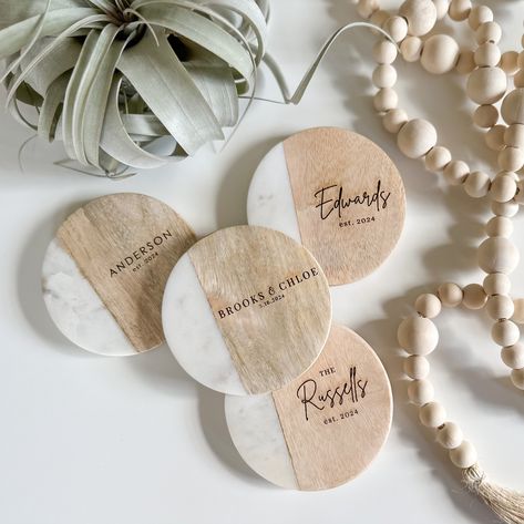 Looking for a personalized gift that combines style and functionality? Look no further than these marble and wood coasters custom coasters. Whether it's for a wedding, housewarming, hostess gift, family gift, teacher gift, anniversary or any special occasion, these coasters make a thoughtful and practical gift. The custom engraving adds a personal touch, making them truly one-of-a-kind. Crafted from high-quality materials, these coasters offer protection for tables and countertops while adding a Realtor Coasters, Laser Wedding Gift, Custom Coasters Diy, Personalized Coasters Wedding, Engraved Coasters, Realtor Closing Gifts, Wedding Coasters, Personalized Wedding Gift, Closing Gift