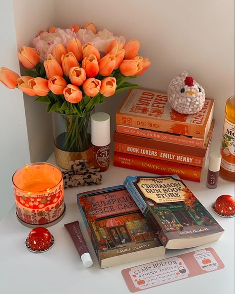 🎃🕯️ Mid October orange book stack 🕯️🎃 QOTD: what kind of books do you like to read during spooky season? ( stars hallow bookmark from @fleursonsunday ) . . . . . . #book #booklover #reader #romancebooks #romancereader #books #tbr #bookshelf #bookstack #bookaesthetic #beautifulbooks #bookshelfdecor #fantasybooks #fantasyreader The Art Of Catching Feelings, Cozy Fall Book Aesthetic, Autumn Book Photography, Cozy Reader Bedroom, Colorful Fall Aesthetic, Cozy Fall Reading Aesthetic, Fall Cozy Books, Fall Decorations Aesthetic, Books And Candles Aesthetic