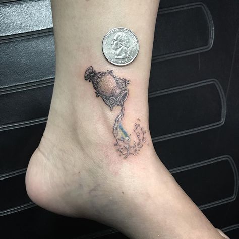 Aquarius Water Bearer Tattoo | Tattoo Ideas and Inspiration Water Bearer Tattoo, Aquarius Symbol Tattoo, Aquarius Tattoos, Aquarius Constellation Tattoo, Floral Back Tattoos, Kitten Tattoo, Aquarius Symbol, Seashell Tattoos, Horoscope Tattoos