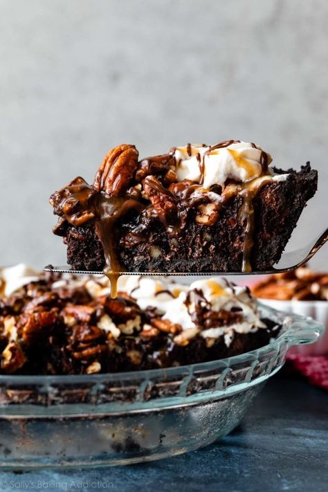 This is a rich, indulgent caramel turtle fudge brownie pie on an Oreo cookie crust. Filled with pecans, chocolate chips, homemade brown sugar caramel sauce, and topped with more pecans, caramel, and whipped cream. Dessert recipe on sallysbakingaddiction.com Chocolate Pie Bars, Fall Chocolate Desserts, Desert Pies, Turtle Fudge, Cookie Pie Recipe, Turtle Brownie, Brownie Pie Recipe, Fudge Brownie Pie, Chips Homemade