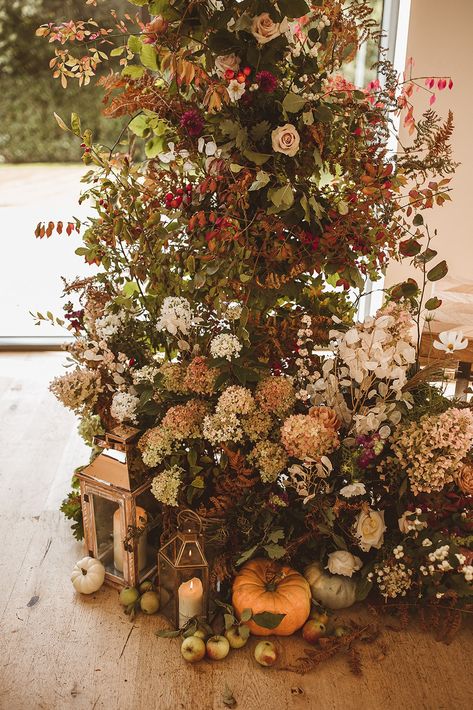 A romantic Autumnal Wedding Ceremony at Surrey countryside Wedding Barn Venue, Millbridge Court | The most gorgeous asymetric floral installment with an abundance of autumnal bracken, foliage, seasonal squashes and hints of blush pink | Floral arrangements by Meadow Folk | Captured by The Springles Floral Hedge Wedding, Meadow Wedding Ceremony, Pink Floral Arrangements, Millbridge Court, Winter Ceremony, Autumnal Wedding, Autumn Weddings, Pumpkin Wedding, Foliage Wedding