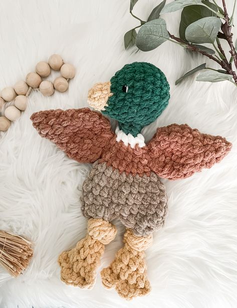 The most adorable new friend for your little! Ready to cuddle with a flat body, stuffed head and tail. Perfect for your little one to hug, carry and snuggle.  Moving, new sibling being born, time to give up the pacifier? Mallard duck lovey is great for bringing comfort too! Sure to be a perfect gift for any child.  Great for duck or hunting themed nursery decor too!  Measures 14" long from beak to feet and is  made of soft blanket yarn. Comes with embroidery eyes which are suitable for all ages! Bass Pro Nursery, Ducks Nursery Theme, Baby Boy Nursery Duck Hunting, Mallard Duck Decor, River Nursery Theme, Nursery Ideas Outdoor Theme, Waterfowl Nursery, Log Cabin Nursery, Duck Boy Nursery