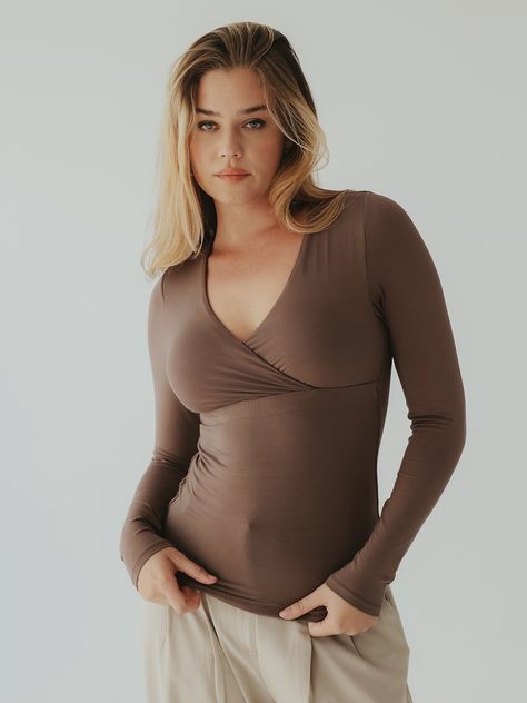 A wrap top with built-in padding so you don't have to worry about what bra to wear. It's made with a soft and stretchy fabric and has our first ever hybrid support band under the chest. This band is a durable elastic wrapped in our modal fabric and only placed in the front of the brami for a smooth back look. Fabric: 92% Modal 8% Spandex Details: Wrap front design, long sleeves, full length Support Level: Medium Fit: True to Size Internal Structure: Hybrid band What Bra To Wear, Wrap Top Long Sleeve, Vintage Photography Women, Modal Fabric, Photography Women, Wrap Top, Vintage Photography, Front Design, Stretchy Fabric